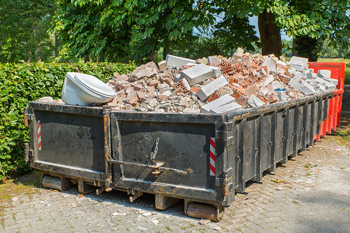 Dumpster full of construction debris.